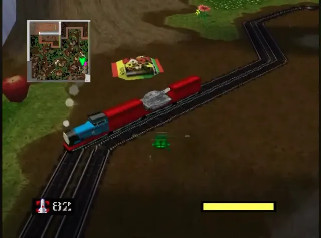 Toy train carrying a Green Army tank through a backyard.